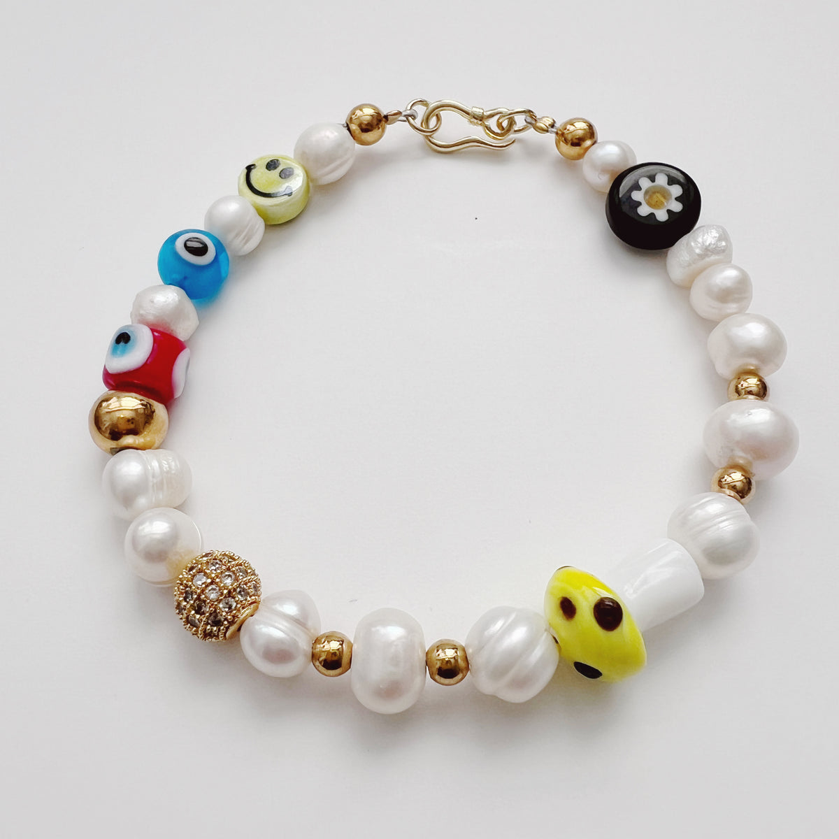Smiley pearl bracelet hotsell